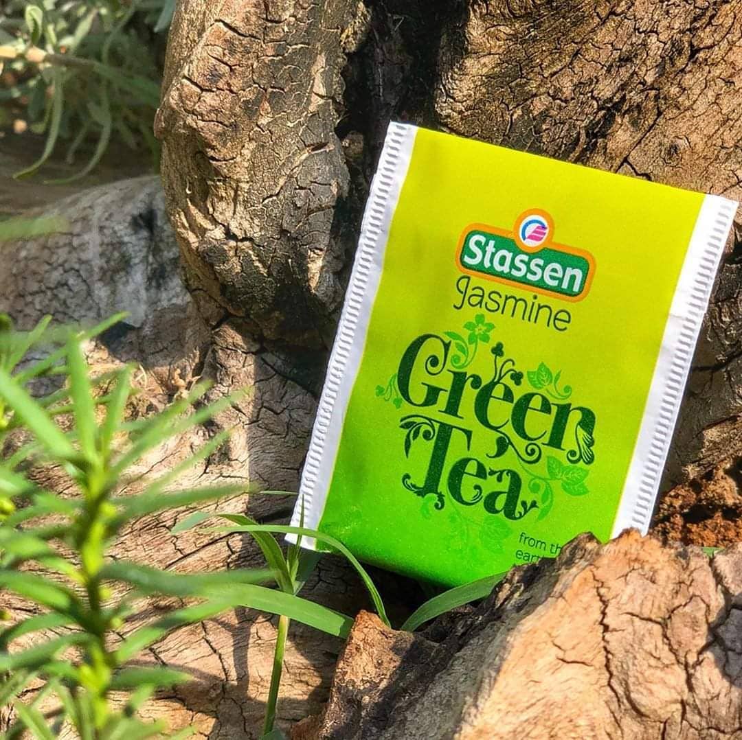 Stassen Jasmine Green Tea enveloped sachet against tree bark